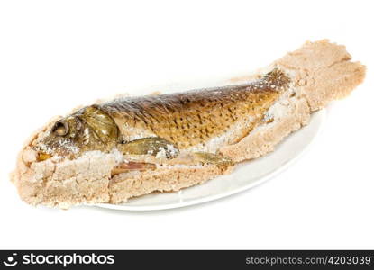 Fish carp baked with bay salt closeup