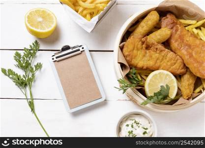 fish chips bowl with lemon clipboard