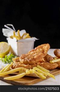fish chips chopping board with lemon copy space