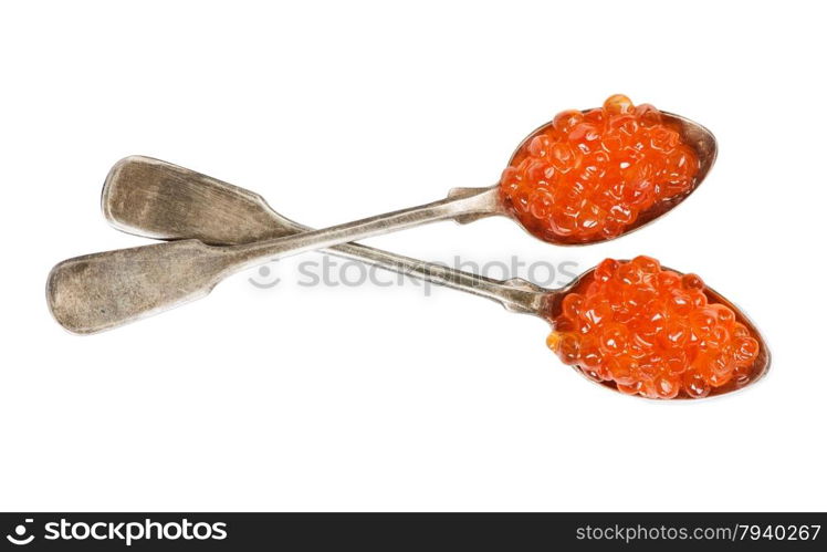 Fish eggs on a two silver spoons over white background