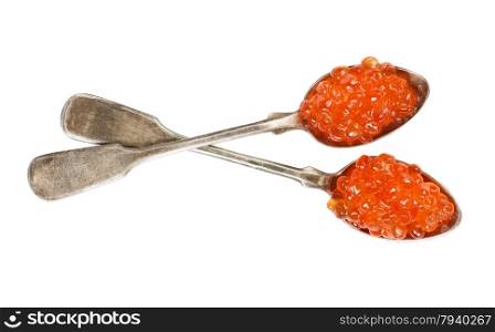 Fish eggs on a two silver spoons over white background
