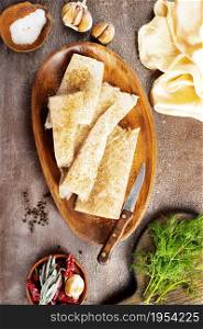 Fish fillet on a woodentray. white fish prepare for cooking