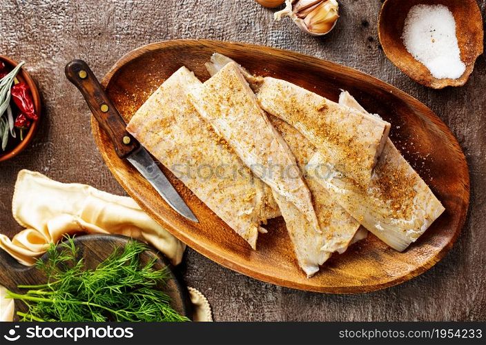 Fish fillet on a woodentray. white fish prepare for cooking