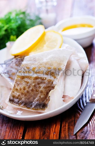 fish fillet with lemon on the plate