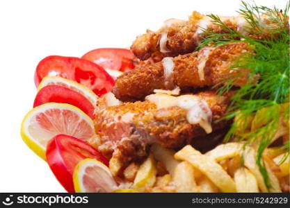 Fish fried in breadcrumbs with tomato and lemon, on a white background
