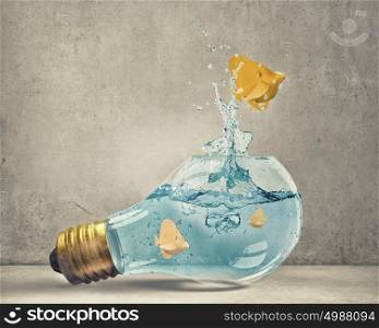 Fish in bulb. Exotic fish in water inside electric light bulb