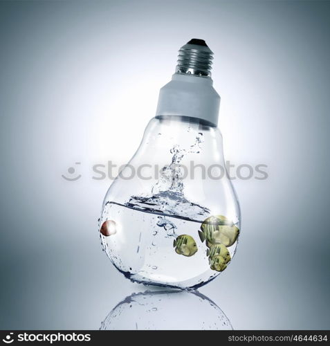 Fish in light bulb. Exotic fish in water inside electric light bulb