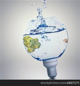 Fish in light bulb. Exotic fish in water inside electric light bulb