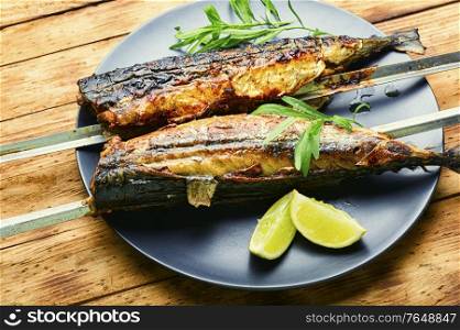 Fish kebab from mackerel.Mackerel on skewers.Fish barbecue skewer.Grilled fish kebab. Fish kebab on skewers