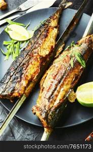 Fish kebab from mackerel. Mackerel on skewers. Grilled fish.. Whole grilled mackerel,skewered