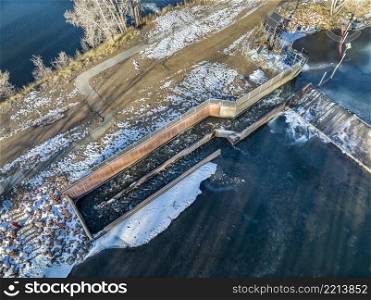fish ladder at water diversion dam - Watson Lake Dam on the Poudre River in northern Colorado, aerial view of winter scenery, wildlife management concept