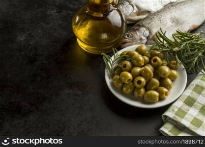 fish olive oil olives dark surface. Resolution and high quality beautiful photo. fish olive oil olives dark surface. High quality beautiful photo concept