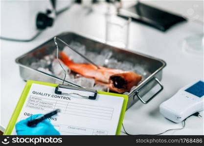 Fish quality control - food safety inspector searching for the presence heavy metals in wild-caught sea fish. Fish Quality Control- Food Safety Inspector Searching for the Presence Heavy Metals in Wild-Caught Sea Fish 