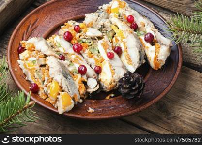 Fish roll.Fish stuffed with vegetables.Banquet dish or Christmas food. Pieces of fish roll