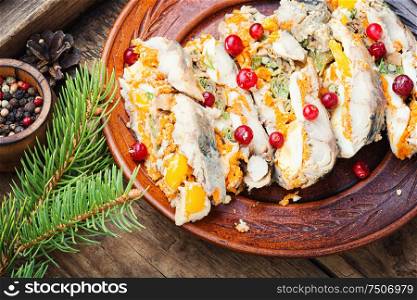 Fish roll.Fish stuffed with vegetables.Banquet dish or Christmas food. Pieces of fish roll