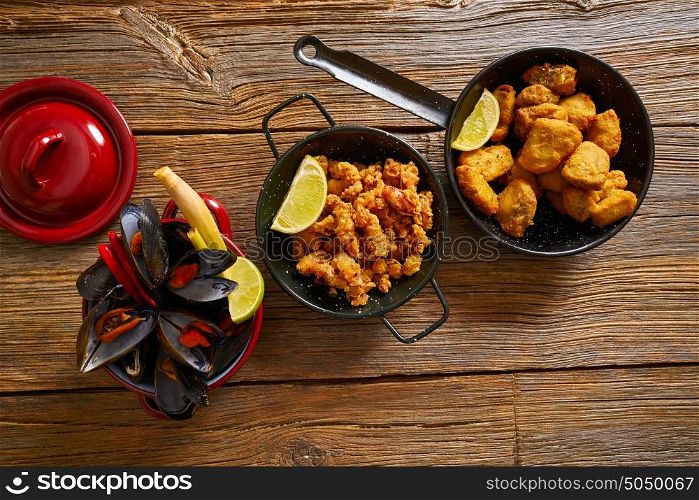 Fish seafood tapas adobo squid and steamed mussels of spain