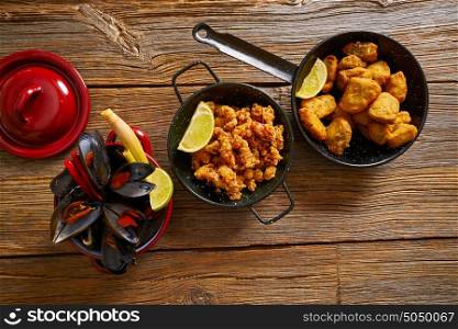 Fish seafood tapas adobo squid and steamed mussels of spain