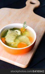 Fish soup served on the table in plate