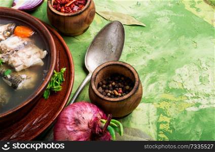 Fish soup with ingredients and spices for cooking. Fish soup in plate