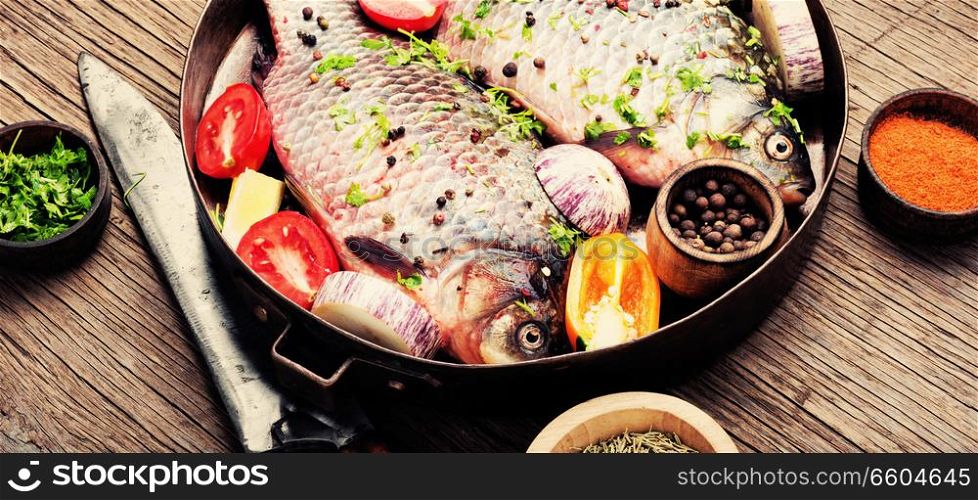 Fish with herbs, spices and vegetables - healthy food.Dietary food. Fresh sea fish with vegetables