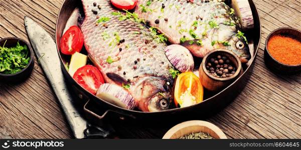 Fish with herbs, spices and vegetables - healthy food.Dietary food. Fresh sea fish with vegetables
