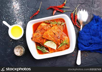 fish with tomato sauce . fish with tomato sauce and aroma spices, stock photo
