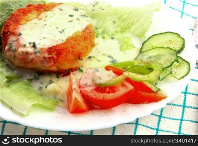 Fishcakes with vegetables.