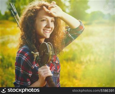 Fisher woman with wintage fishing pole, walking to the summer river, relaxation and leisure backgrounds
