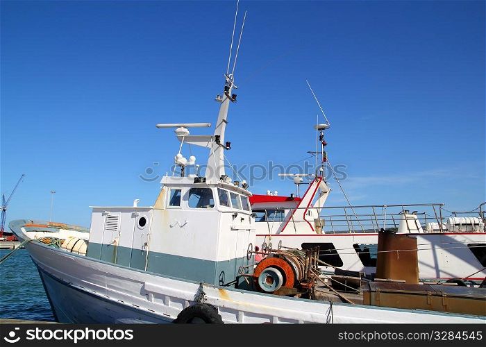 Fisherboat on mediterranean harbor professional fishing boats