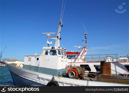 Fisherboat on mediterranean harbor professional fishing boats