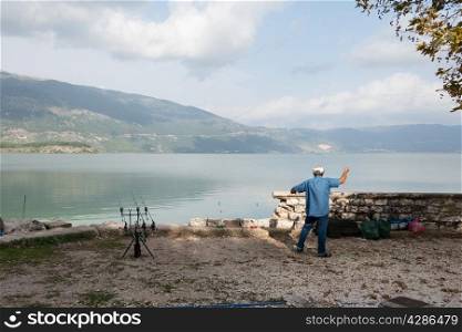 Fisherman at lake at Ioannina, Northern Greece