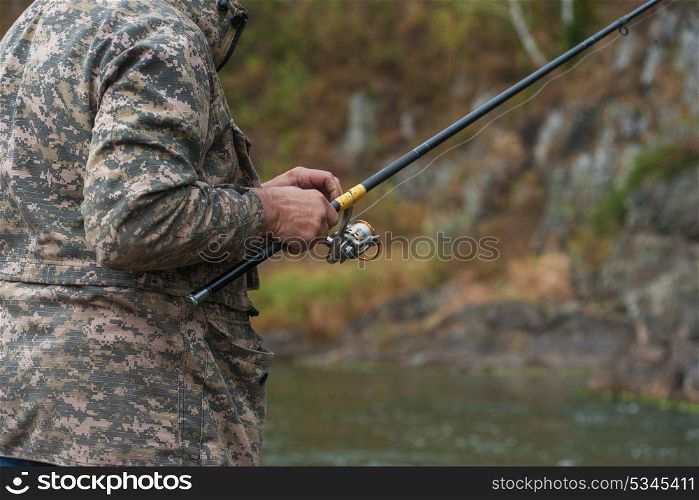 Fisherman at the Altai river. Fisherman at the Altai river, closeup photo