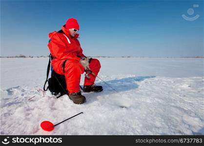 Fisherman enjoying a days fishing on the ice