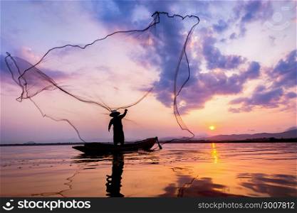 Fisherman of Bangpra Lake in action when fishing Thailand