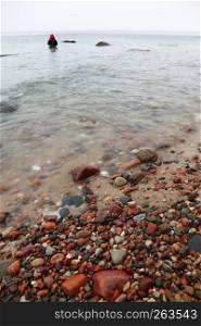Fisherman Stones in sea water autumn in Orlowo, Gdynia Poland