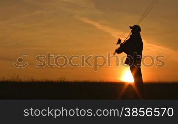 fisherman throws fishing tackles