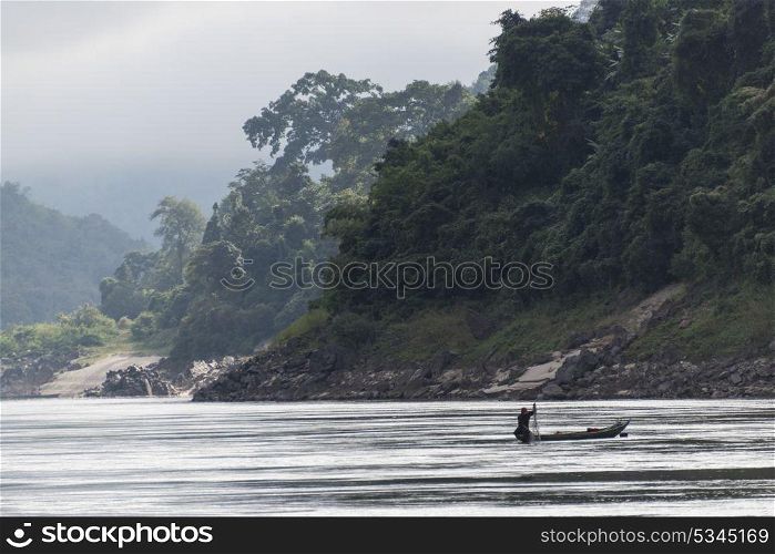 Fisherman with his net in River Mekong, Laos