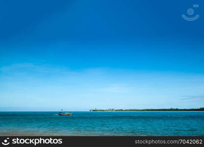 fisherman with longtail boat in the blue sea at Ko Kho Khao, Phang Nga Thailand