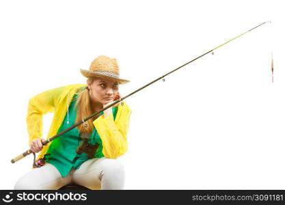 Fishery, spinning equipment, angling sport and activity concept. Bored woman with fishing rod, waiting for fish to hunt.. Woman with fishing rod , spinning equipment