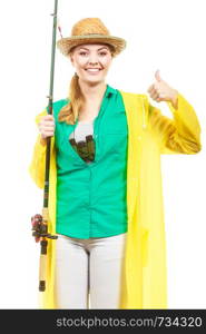Fishery, spinning equipment, angling sport and activity concept. Woman with fishing rod showing thumb up gesture. Woman with fishing rod, spinning equipment