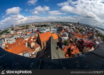 Fisheye aerial view of Riga city from st. Peter's church in Latvia. Panoramic view of Riga with cloudy blue sky. Fisheye lens.