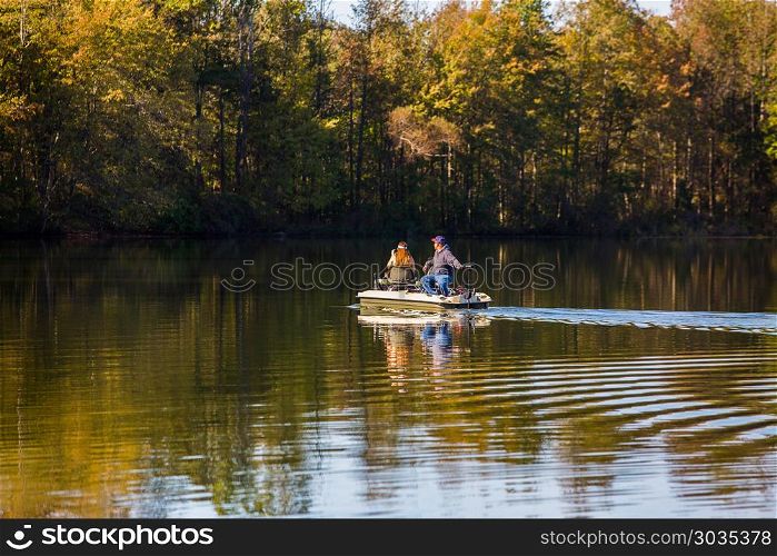 Fishing at the lake. Fishing at the lake in autumn with a boat