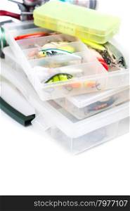 fishing baits and lure in transparent plastic storage boxes on bright white background. for design advertising or publication