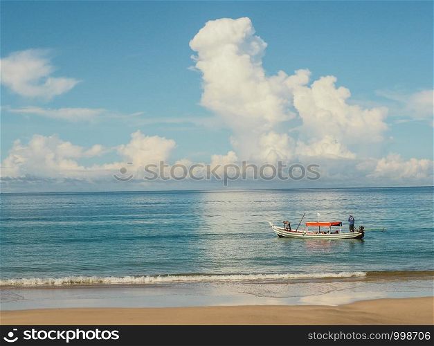 Fishing boat and blue sea.