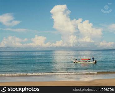 Fishing boat and blue sea.