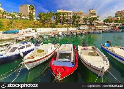 Fishing boat and wharf of Chania in sunny summer day, Crete, Greece