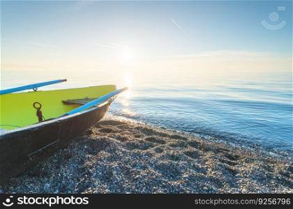 Fishing boat at sunset time. Nature composition.