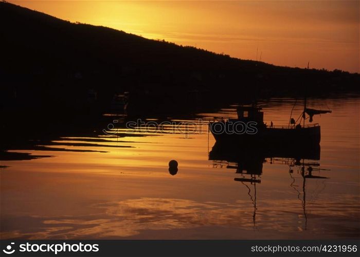 Fishing boat in sunset/sunrise in Norway