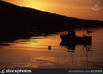 Fishing boat in sunset/sunrise in Norway