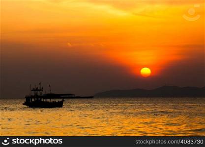 Fishing boat in Thailand. Silhouette of Fishing Boat on Sunrise.
